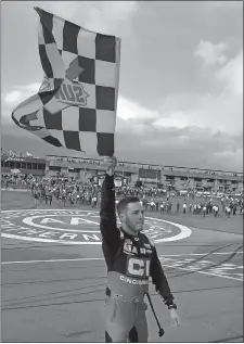  ?? WILL LESTER/AP PHOTO ?? Alex Bowman celebrates with the checkered flag after winning the NASCAR Cup race on Sunday in Fontana, Calif.