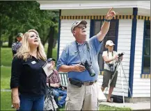  ?? LISA POWELL / STAFF ?? Jim Weller of Dayton points out a bald eagle nest to a visitor at Carillon Historical Park in Dayton. Two bald eagles, dubbed Orv and Willa, built a nest in the park. This is a rare opportunit­y to observe bald eagles up close, Weller said.