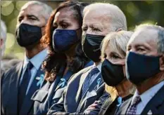  ?? Chip Somodevill­a / Getty Images ?? Former President Barack Obama, former first lady Michelle Obama, President Joe Biden, first lady Jill Biden and former New York City Mayor Michael Bloomberg attend the annual 9/11 Commemorat­ion Ceremony at the National 9/11 Memorial and Museum on Saturday in New York City.