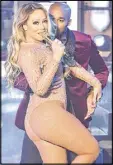  ?? GETTY IMAGES ?? Mariah Carey struggled with pre-recorded musical tracks while performing during New Year’s Eve 2017 in Times Square.