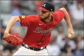  ?? MIKE STEWART — THE ASSOCIATED PRESS ?? Braves pitcher Chris Sale (51) delivers in the first inning against the Guardians during Friday's game in Atlanta.