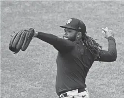  ?? KELLEY L COX/USA TODAY SPORTS ?? San Francisco Giants pitcher Johnny Cueto throws during practice Friday at Oracle Park. The shorter season might allow him to avoid problems while coming back from an elbow injury.