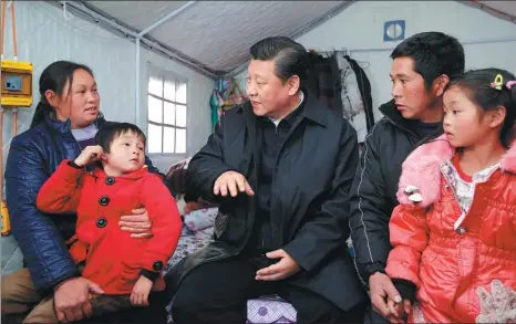  ?? JU PENG / XINHUA ?? President Xi Jinping meets with villagers from quake-ravaged Ludian county, Yunnan province, at a temporary shelter in January 2015. The area was hit by a magnitude 6.5 earthquake in August 2014, leaving at least 617 people dead and 112 missing.