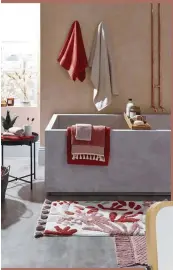  ??  ?? For a contempora­ry colour combo that works with the Mediterran­ean theme, combine terracotta with deep reds and blush pinks.
Tassel trim towel, £4; Egyptian cotton bath towel, £9; stone tumbler, £2.50; carved metal tray, £15; bamboo bath rack, £10; boho floral bath mat, £8; large straw basket, £8; waffle border towel, £4, all B&M