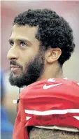  ??  ?? San Francisco quarterbac­k Colin Kaepernick is protesting the state of race relations in the U.S. by not standing for the national anthem.