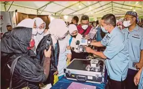  ?? FILE PIC ?? Visitors at a technical and vocational education and training exhibition in Shah Alam, Selangor, last year. A total of RM6.7 billion was allocated during the 2023 Budget last year.