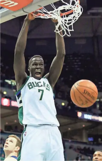  ?? ASSOCIATED PRESS ?? Bucks rookie Thon Maker scores two of his career-high 23 points on Friday night against the Pistons.