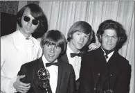  ??  ?? TV STARS: The Monkees, from left to right, Mike Nesmith, Davy Jones, Peter Tork, and Micky Dolenz, with their Emmy Award in 1967.