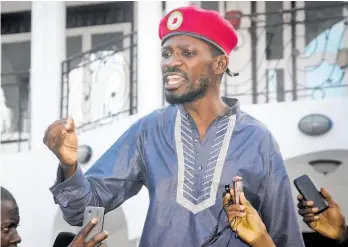  ?? Photo / AP ?? Pop star and political activist Bobi Wine greets followers as he arrives home from prison in Kampala, Uganda.