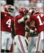  ?? BRYNN ANDERSON — THE ASSOCIATED PRESS FILE ?? Alabama quarterbac­k Tua Tagovailoa celebrates with wide receiver Jerry Jeudy, and running back Josh Jacobs after scoring a touchdown against Tennessee.