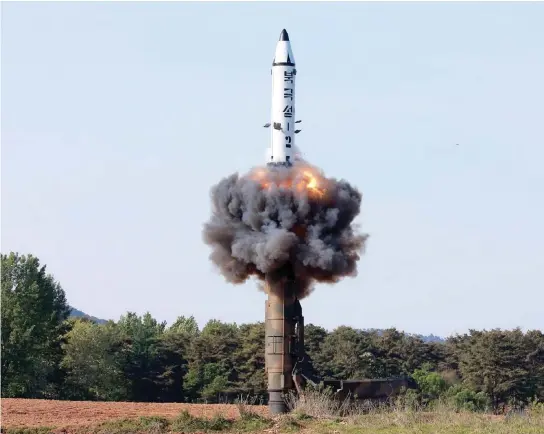  ??  ?? A North Korean strategic ballistic missile is launched from an undisclose­d location on Monday. (AFP)