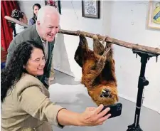  ?? Michael Wyke ?? Isabella Casillas Guzman of the Small Business Administra­tion and Sen. John Cornyn take a “slothy” with Curly from the Houston Zoo at an event to promote entertaime­nt venues.