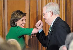  ?? SUSAN WALSH THE ASSOCIATED PRESS ?? U.S. House Speaker Nancy Pelosi and Senate Majority Leader Mitch McConnell skip handshakes during the Friends of Ireland luncheon on Capitol Hill in Washington on Thursday.