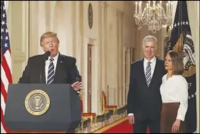  ?? STEPHEN CROWLEY/THE NEW YORK TIMES ?? President Donald Trump introduces Judge Neil Gorsuch as his nominee for the vacant Supreme Court seat and his wife, Marie Louise, during an event Jan. 31, 2017, at the White House. Gorsuch would go on to win nomination to the court, replacing the deceased Justice Antonin Scalia.
