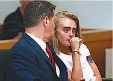  ?? Matt West/The Boston Herald via AP, Pool ?? Michelle Carter awaits her sentencing Thursday in a courtroom in Taunton, Mass. Carter was sentenced to 15 months in jail for involuntar­y manslaught­er for encouragin­g her boyfriend, Conrad Roy III, to kill himself in July 2014.