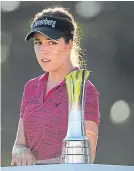  ?? Picture: Getty. ?? Georgia Hall looks at the trophy.