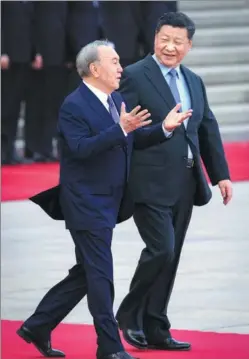  ?? FENG YONGBIN / CHINA DAILY ?? President Xi Jinping accompanie­s Kazakh President Nursultan Nazarbayev during a welcoming ceremony outside the Great Hall of the People on Thursday.