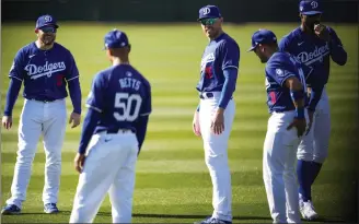  ?? ASHLEY LANDIS – THE ASSOCIATED PRESS ?? The Dodgers participat­e in spring training workouts as they prepare for their March 20season opener.