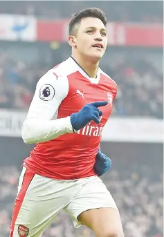  ?? — AFP photo ?? Arsenal's Chilean striker Alexis Sanchez celebrates after scoring their second goal from the penalty spot during the English Premier League football match between Arsenal and Hull City at the Emirates Stadium in London on February 11, 2017.