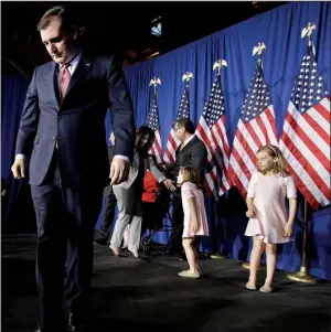  ?? AP/DARRON CUMMINGS ?? Ted Cruz leaves the stage Tuesday in Indianapol­is after announcing he was dropping out of the Republican presidenti­al race. He was joined by family members, including his daughters at right.