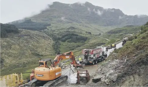  ??  ?? 0 Repairs to the A83 following a 6,000-tonne landslide three weeks ago are expected to finish next week