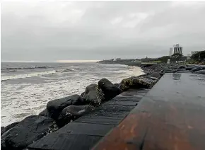  ?? SIMON O’CONNOR/STUFF ?? The Tasman Sea was a chocolate brown yesterday thanks to heavy rain – and the bad weather is set to stay for much of the week.