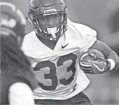  ?? KELLY PRESNELL/ARIZONA DAILY STAR ?? Running back Nathan Tilford (33) is expected to see time on the Arizona offense as a freshman, potentiall­y in the slot position.