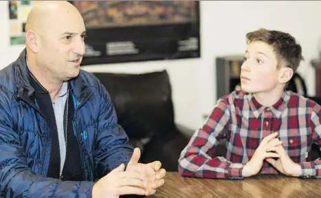  ?? FRANCIS GEORGIA ?? Donor John Montalbano, and his son Luke, 12, meet with volunteers who provide food at the school on weekends for families who otherwise would go hungry. Poverty can have a lasting effect on children, often greatly reducing their likelihood to graduate...