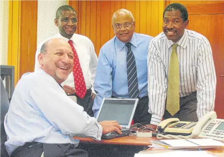  ?? /Trevor Samson ?? Steady hands: Then finance minister Trevor Manuel in his office with, from left, Jabu Moleketi, Pravin Gordon and Lesetja Kganyago before the 2005 Budget announceme­nt . Of the four, only Kganyago remains in the public sector, as governor of the Reserve...