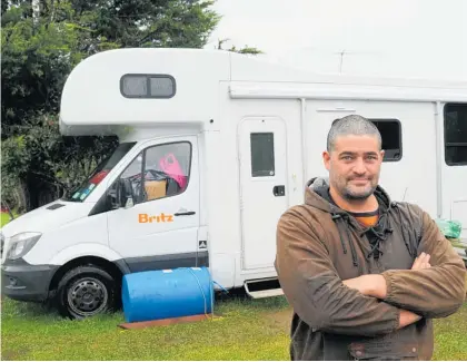  ?? Photo / Peter de Graaf ?? Home sweet home: Davan Heihei has traded a wet, flea-ridden tent for a campervan thanks to an iwi emergency accommodat­ion initiative.