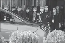  ?? [NG HAN GUAN/ THE ASSOCIATED PRESS] ?? In this Friday photo, members of the World Health Organizati­on team of researcher­s prepare to leave on a field trip in Wuhan in central China's Hubei province.