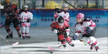  ?? PROVIDED TO CHINA DAILY ?? Children play ice hockey, as part of a winter sports festival in Beijing last year. As China is stepping up preparatio­ns for the 2022 Olympic and Paralympic Winter Games, ice and snow sports are becoming increasing­ly popular nationwide.