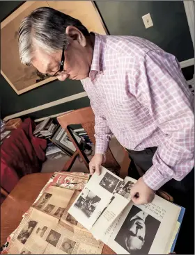  ?? Arkansas Democrat-Gazette/JOHN SYKES JR. ?? Richard Yada, 74, looks over memorabili­a that people from around the United States have sent to him at his Little Rock home. Yada was born in a Japanese internment camp in Rohwer while his family was imprisoned there during World War II.
