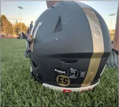  ??  ?? Each Golden Valley football player will be wearing a sticker with the letters “ES” in honor of cheer and dance coach Ed Santos, who died on July 26 after suffering a stroke.
Courtesy photo
