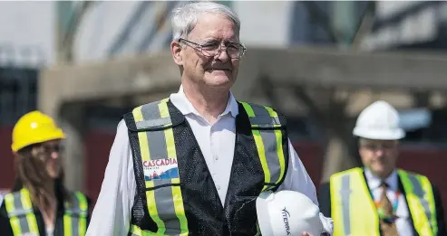  ?? BEN NELMS / THE CANADIAN PRESS FILES ?? Transport Minister Marc Garneau takes part in an inspection of a deep sea vessel last week in Vancouver. Garneau’s sprawling reform of transport laws, known as Bill C-49, appears poised for approval.