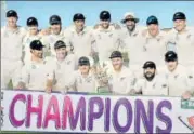  ?? AFP ?? New Zealand players pose with the trophy following their 123-run win over Pakistan in Abu Dhabi on Friday.