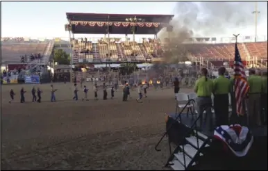  ?? Clark Caras ?? A flag retirement ceremony takes place at the Spanish Fork Rodeo Arena on July 15.