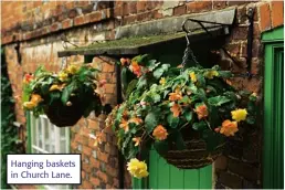  ??  ?? Hanging baskets in Church Lane.