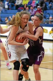  ?? AUSTIN HERTZOG - DIGITAL FIRST MEDIA ?? Boyertown’s Abby Kapp and Garnet Valley’s Nicole Barnes battle for a rebound during their PIAA 6A second round game Thursday at Spring-Ford.