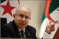  ?? (AP/Fateh Guidoum) ?? Algerian Foreign Minister Ramtane Lamamra reads a statement from the country’s president Tuesday, saying the nation was cutting ties with Morocco.