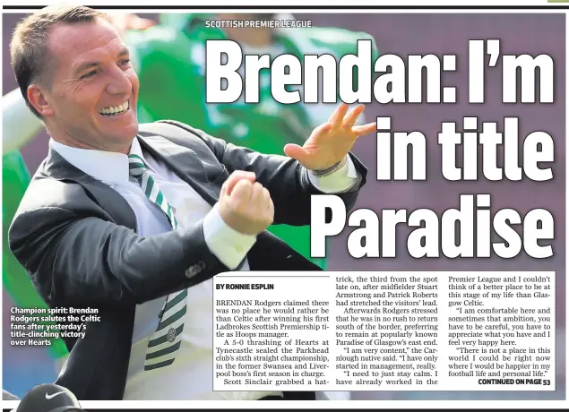  ??  ?? Champion spirit: Brendan Rodgers salutes the Celtic fans after yesterday’s title-clinching victory over Hearts