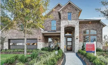  ??  ?? Cane Island features a selection of new homes on 50- to 100-foot homesites in gated neighborho­ods and on cul-de-sacs, all well designed throughout the 1,200-acre community.