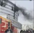  ??  ?? Smoke was seen pouring from the upper floors of the building