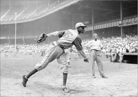  ?? Matty Zimmerman / Associated Press ?? Thpitcher Satchel Paige and others will have all their statistics included as MLB has reclassifi­ed the Negro Leagues as a major league.