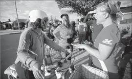  ??  ?? DIANE ROBERTSON, left, Carole Gillie, Jayme Pohl and Sandy Zalagens chat before they begin walking together in Leimert Park.