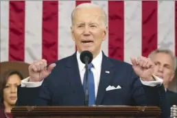  ?? Jacquelyn Martin pool photo via AP file ?? President Joe Biden delivers the State of the Union address to a joint session of Congress at the U.S. Capitol, Feb. 7, in Washington, as Vice President Kamala Harris and House Speaker Kevin McCarthy of Calif., listen. Biden’s upcoming budget proposal aims to trim deficits by nearly $3 trillion over the next decade. That’s according to an administra­tion official who insisted on anonymity to discuss the figures being released Thursday. The level of deficit reduction is significan­tly higher than the $2 trillion worth of deficit reduction that Biden had promised in his State of the Union address last month.