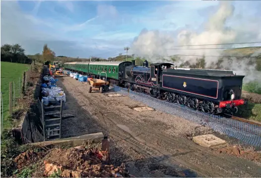  ?? Mel Holley
News Writer ?? Just weeks before the March 2020 lockdown, T9 30120 passes Herston carriage shed site, with the foundation­s under constructi­on. (Andrew Wright)