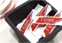  ?? ?? “I Voted” stickers are seen at the Tyner Community Center on Tuesday.