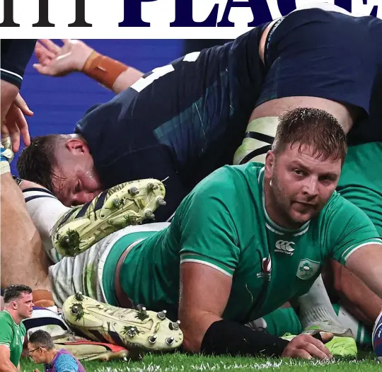  ?? ?? Touch down: Iain Henderson scores against Scotland (main); James Ryan receives medical attention (left)