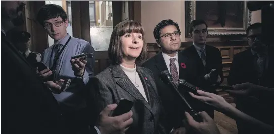  ?? CHRIS YOUNG/ THE CANADIAN PRESS ?? Ottawa-Orleans MPP Marie-France Lalonde, Ontario’s community safety minister, speaks with journalist­s outside the Queen’s Park Legislativ­e chamber on Thursday following the unveiling of the Safer Ontario Act, which the government calls “the largest...